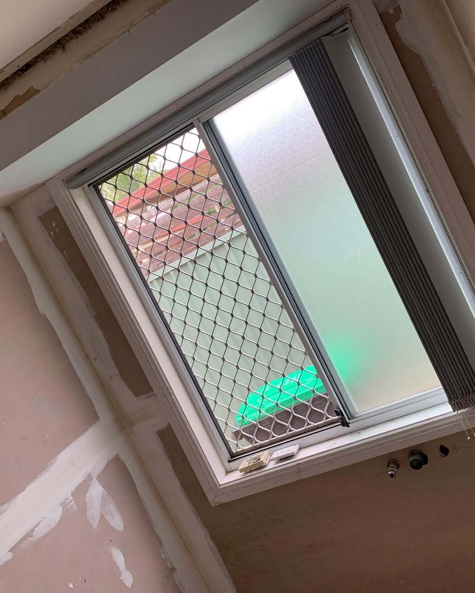 Bathroom in progress — new window framing