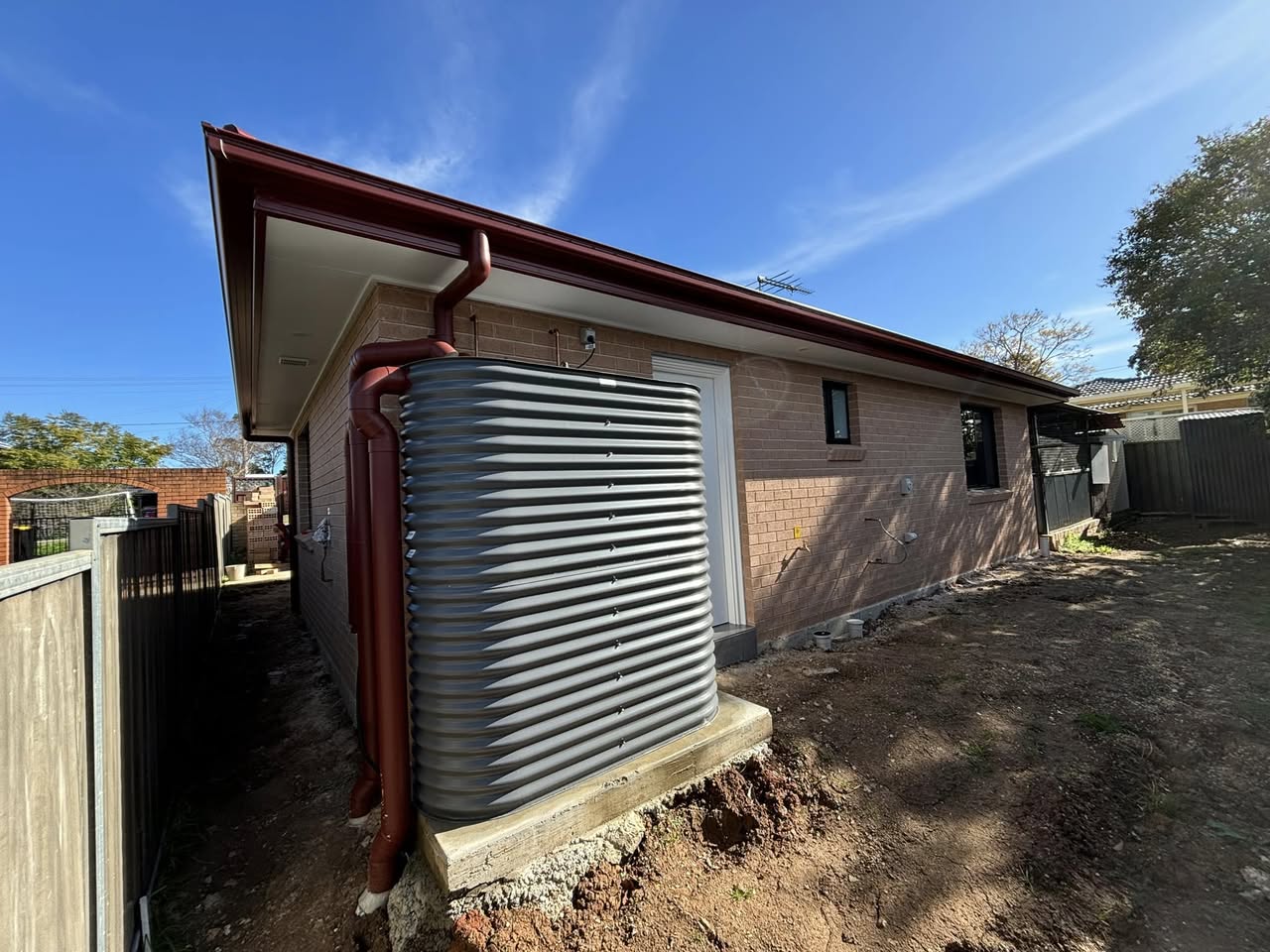 Granny flat exterior with water tank