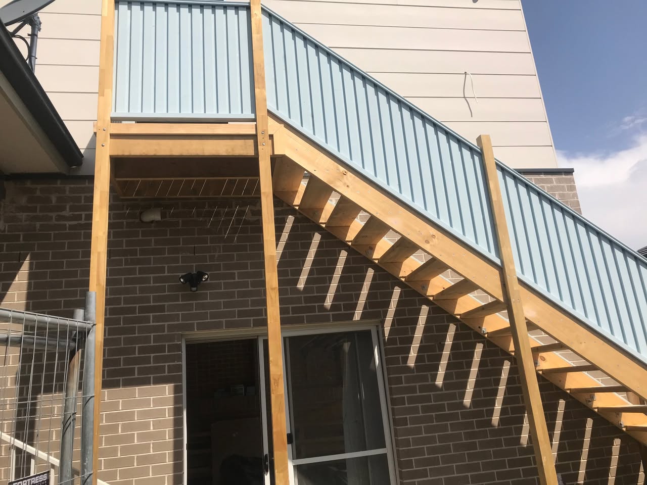 Elevated external staircase framing and Colorbond balustrade