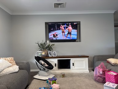 Wall-mounted TV with built-in entertainment unit